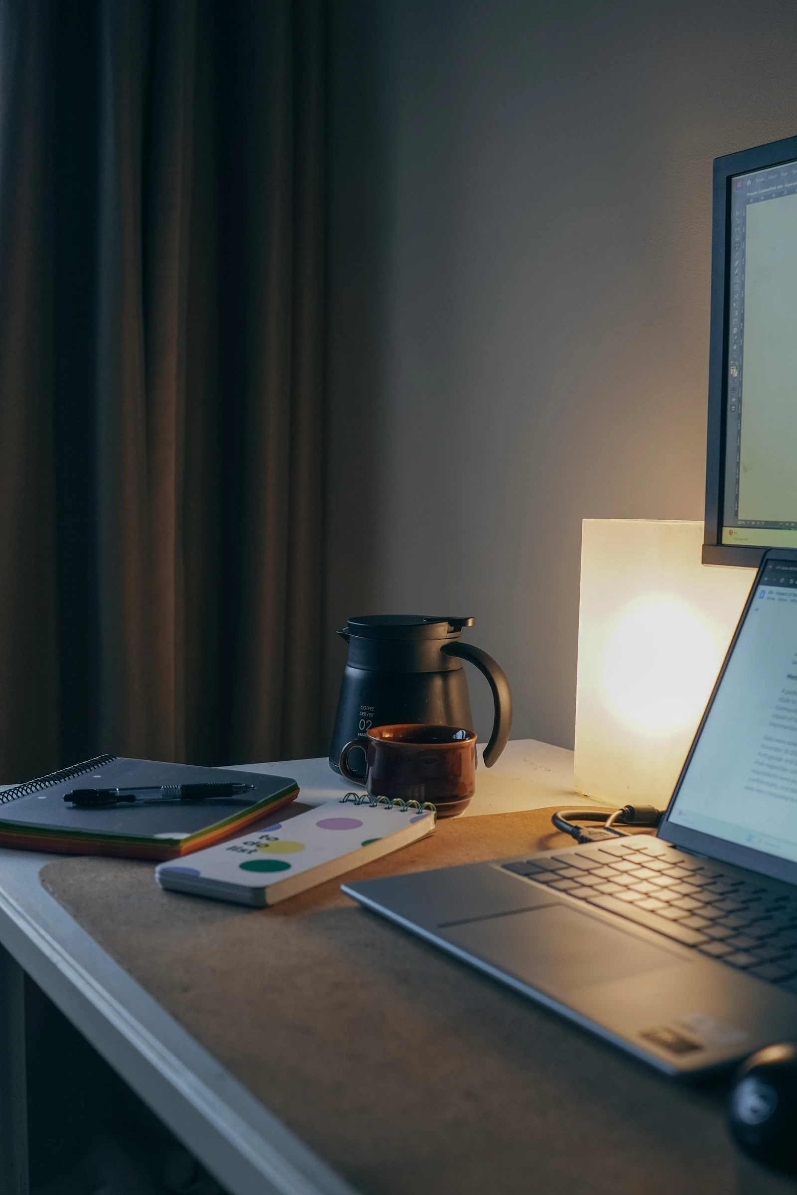 Laptop, notebook and coffee on a wooden desk — calm workspace
